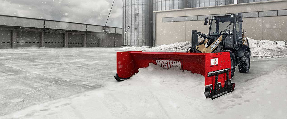 Western Pile Driver with Trace Edge Technology pusher box plow